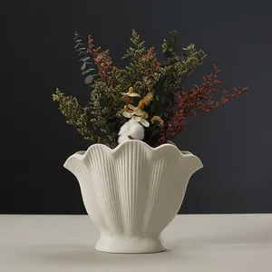 Nordic white shell-shaped ceramic vase with fluted texture for elegant home decor