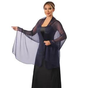 Detailed view of lightweight navy blue sheer shawl draped on an elegant model