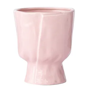 Elegant pink ceramic vase with a unique Nordic wrinkled texture design for home decor