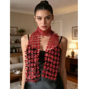 Detailed shot of a red floral lace scarf with sparkling sequins for party wear