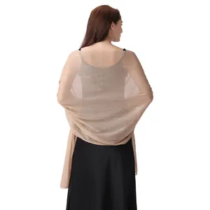 Back view of elegant champagne chiffon shawl with silver threads and rhinestones for evening dress.