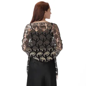 Back view of a black lace shawl with gold sequins in a paisley pattern for evening gowns