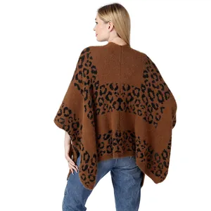 Rear view of stylish brown leopard print knit poncho with soft texture and side slits
