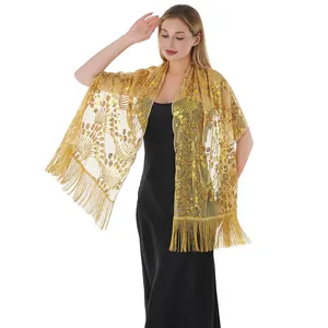 Full body view showing gold sequin peacock embroidery and long tassel detail on model