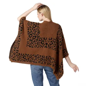 Detailed back view of a cozy brown leopard print knit poncho with soft open sides
