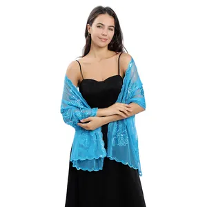 Detailed view of sky blue peony sequin embroidered shawl on a professional model