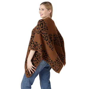 Close-up view of the high-quality brown leopard print knitted poncho with a side slit