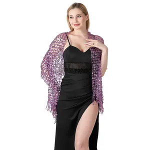 Close-up of elegant purple sequined shawl with tassels worn on black evening gown