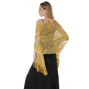 Back view detail of golden sequin shawl with elegant peacock tail pattern and tassels