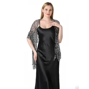 Elegant silver sequin mesh shawl draped over a black satin evening dress for parties