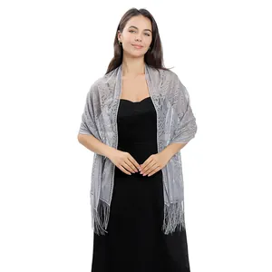 Elegant silver floral lace evening shawl with fringes styled over a black dress for parties
