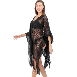 Black lace beach cover up poncho featuring beautiful paisley pattern and fringe details