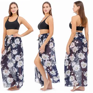 Multi-angle view of a navy blue floral print beach sarong wrap with high slit detail