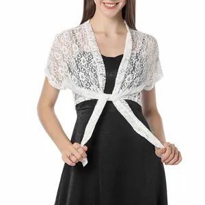 Detail of elegant white floral lace bolero shrug with adjustable front tie.