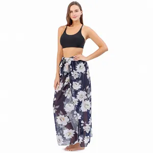 Floral print beach sarong wrap skirt cover-up shown on a model against white background