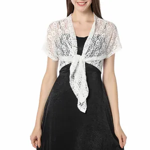 Detailed view of white floral lace bolero shrug showing delicate pattern and tie closure