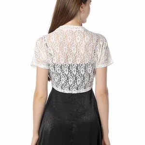 Back view of a white floral lace bolero shrug paired with a black dress for women.