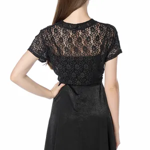 Detailed back view of a women's black floral lace shrug bolero paired with a dress.