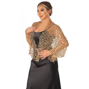 Close-up detail of the intricate gold sequin mesh shawl for evening party wear