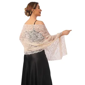 Detailed back view of an elegant beige floral lace shawl decorated with sparkling rhinestones