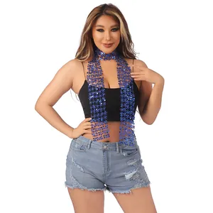 Close-up of shiny blue sequin scarf styled on a model in a trendy ethnic outfit.