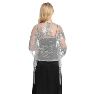 Detailed view of silver sequined sheer shawl with elegant fringe for evening wear