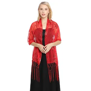 Elegant red mesh shawl with sequins and fringe worn by a model in a black evening dress