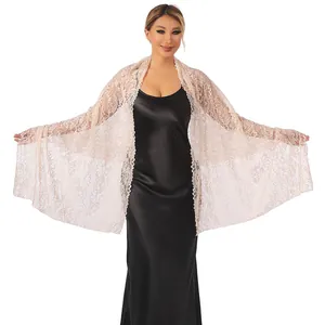 Detailed view of champagne lace shawl with sparkling rhinestones for bridal evening dresses