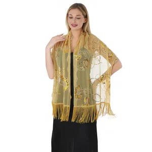 Detailed look of golden sequin embroidered shawl with elegant long tassels