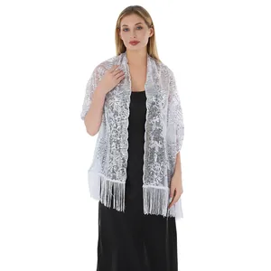 Detailed view of silver sunflower sequin embroidery and fringe on evening shawl wrap