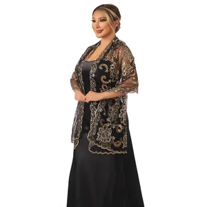 Detail of elegant black mesh shawl with gold lotus sequin embroidery for evening gowns