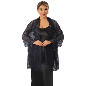 Elegant navy blue floral lace shawl with sparkling rhinestones over a satin dress