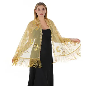 Elegant gold sequin embroidered evening shawl wrap with fringe tassels on model