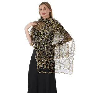 Detailed view of elegant golden phoenix tail sequin embroidery on black mesh shawl