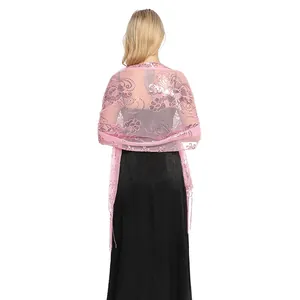 Elegant pink sequin tassel shawl wrap shown from the back over a black party dress