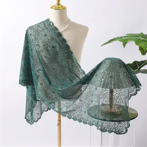 Detail view of elegant green floral sequin embroidered lace shawl wrap