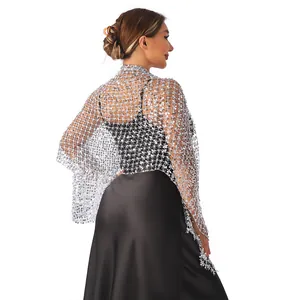 Detailed view of elegant silver sequin mesh shawl worn over a black evening dress