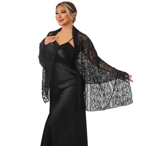 Detailed shot of black floral lace shawl with sparkling rhinestone embellishments.