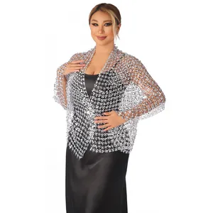 Detailed view of elegant silver sequin mesh shawl paired with a black satin evening dress