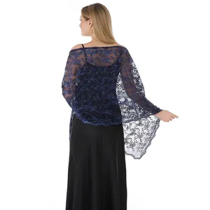Detailed view of the navy blue sequin embroidered lace shawl on the back of the dress.