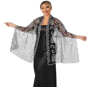 Elegant black sheer shawl featuring intricate silver lotus sequin embroidery on an Asian model