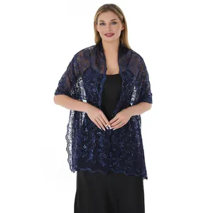 Elegant navy blue lace shawl with shimmering sequin phoenix pattern shown on a model.