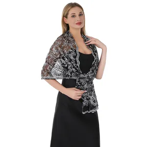 Detailed view of elegant black shawl with silver sequin phoenix tail embroidery.