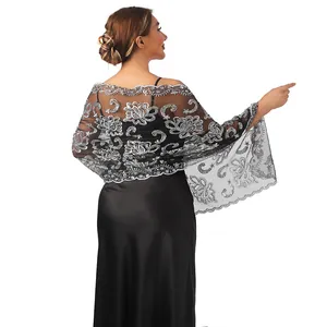 Detailed back view of an elegant black mesh shawl with silver lotus sequin embroidery