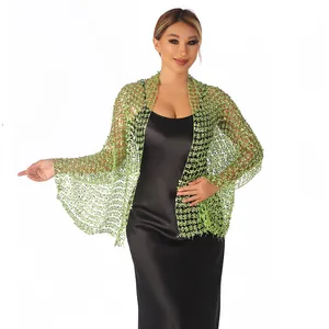 Detail of an elegant light green sequined mesh shawl wrap for evening party dresses