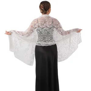 Elegant white floral lace shawl shown from the back, paired with a black evening dress.