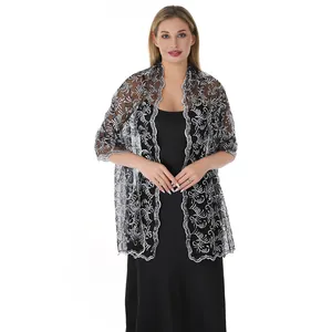 Detailed view of an elegant silver sequined lace shawl with phoenix tail embroidery.