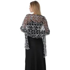 Detailed view of elegant black and silver sequin embroidered shawl with phoenix pattern.