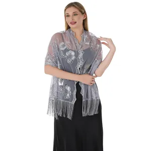 Detailed view of silver sequin embroidered floral mesh shawl with elegant tassels