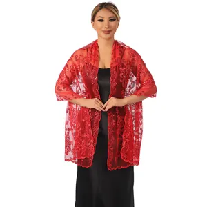 Close-up detail of elegant red lace shawl featuring sequin lotus embroidery on model